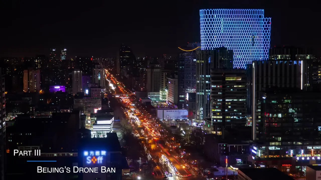 Beijing city skyline at night during the news segment about a consumer drone ban