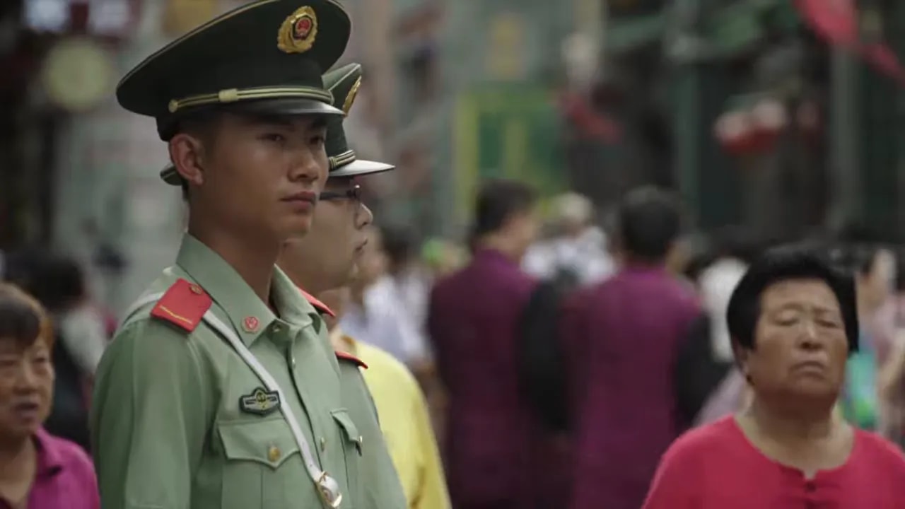 Chinese security officer standing in formation during a public event