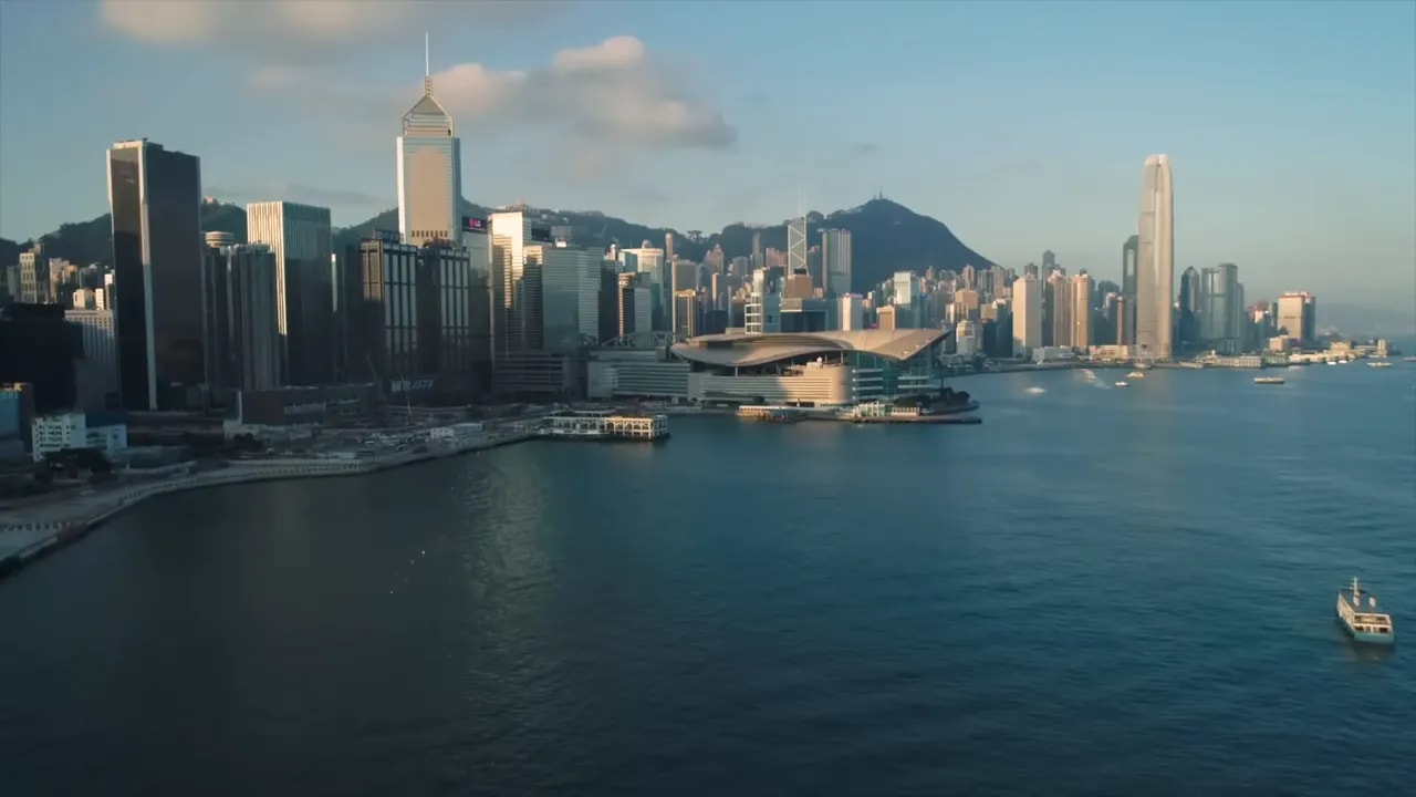 Hong Kong skyline along the harbor with office buildings and a large waterfront