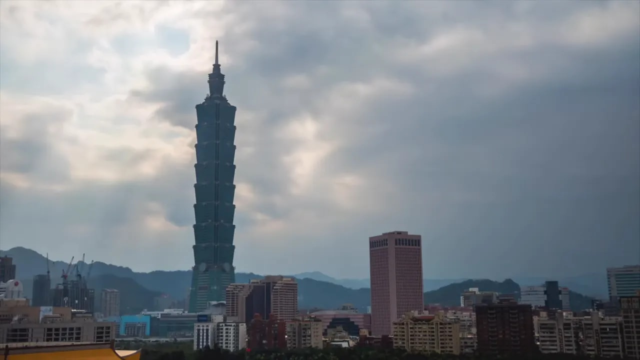 Taipei skyline with Taipei 101 tower under cloudy skies