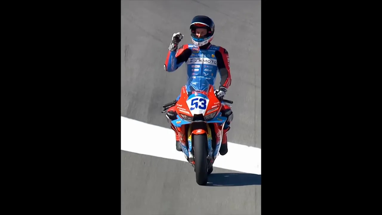 Front-on view of ZX Moto Superbike rider number 53 on track