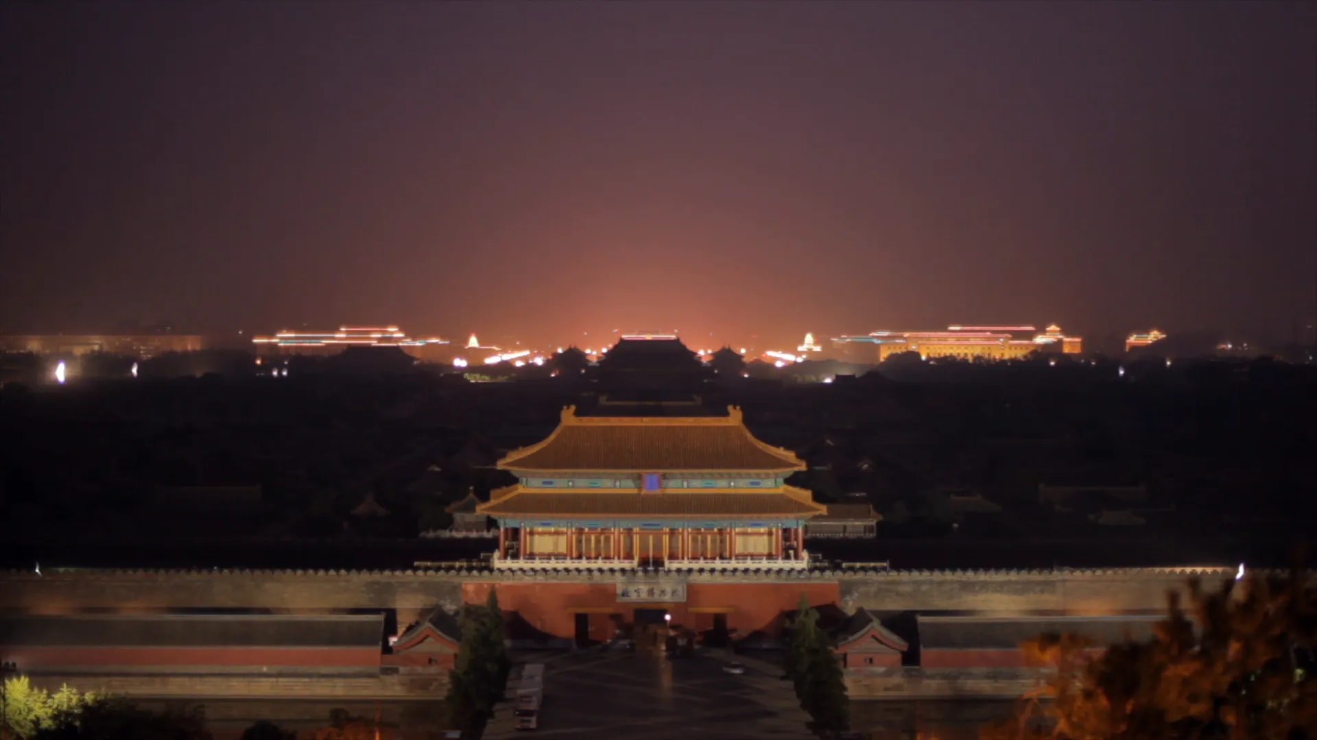 Nighttime view of Beijing Tiananmen and ceremonial buildings with city lights